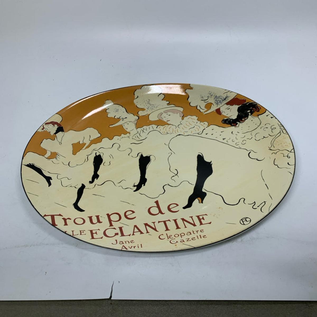 OVAL PLATTER WOMAN LINE DANCING W/ LEGS UP.